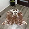 Tan brown cowhide rug