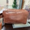 Leather toiletry bag with waterproof lining and interior pockets