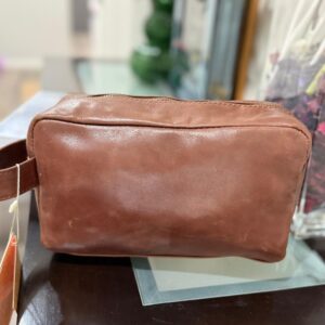 Leather toiletry bag with waterproof lining and interior pockets