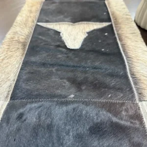 Cowhide bullhead table runner with bullhead patch, having leather fringes